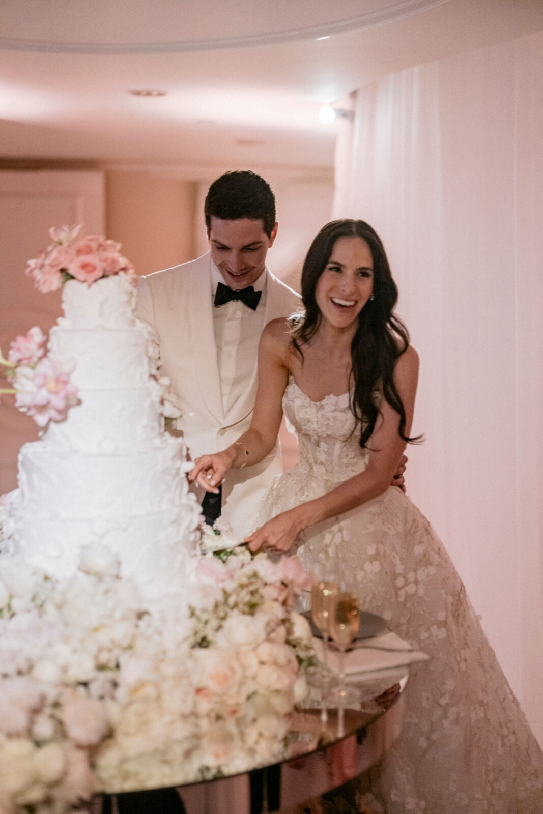 couple slicing cake