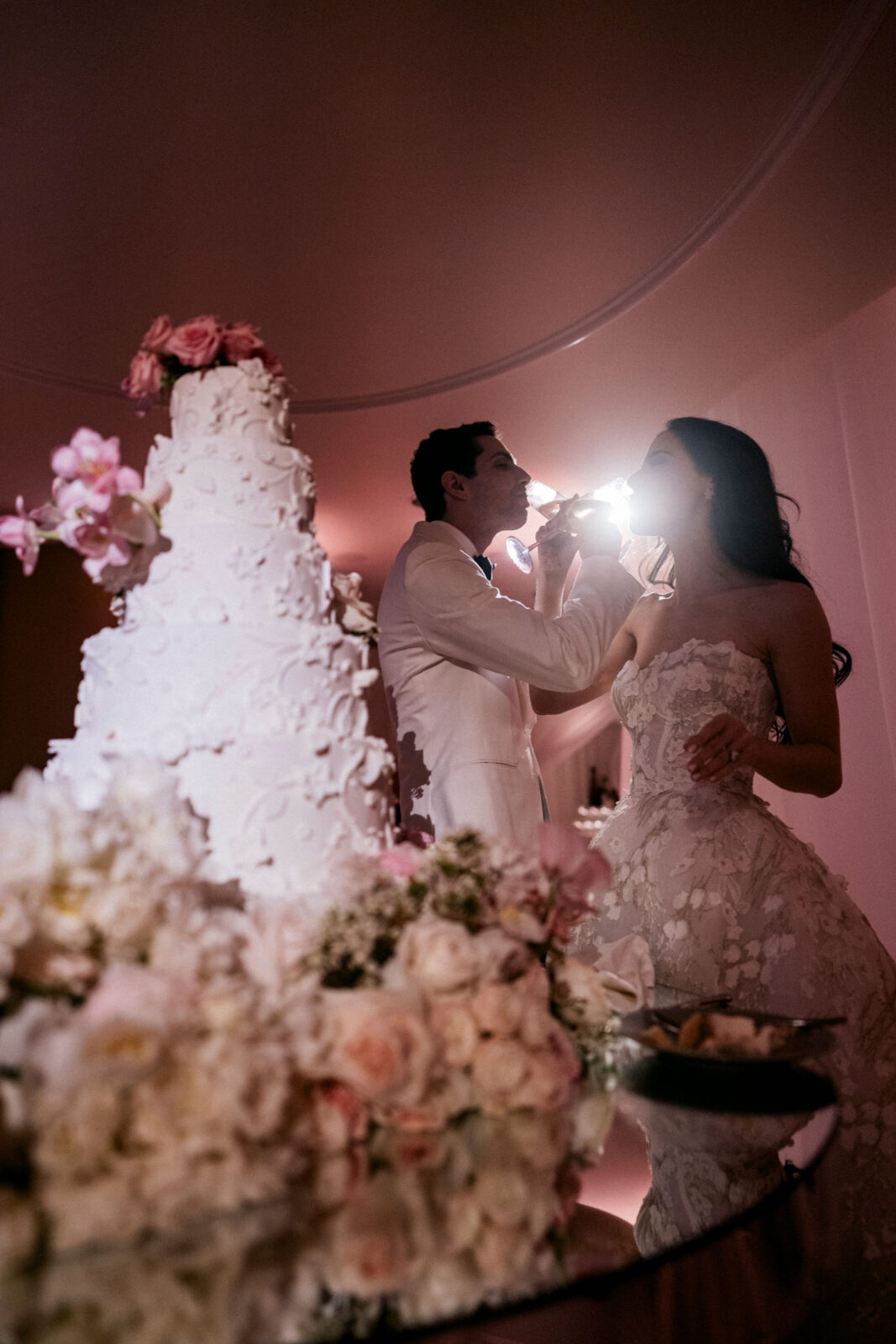 bride and groom wine sharing