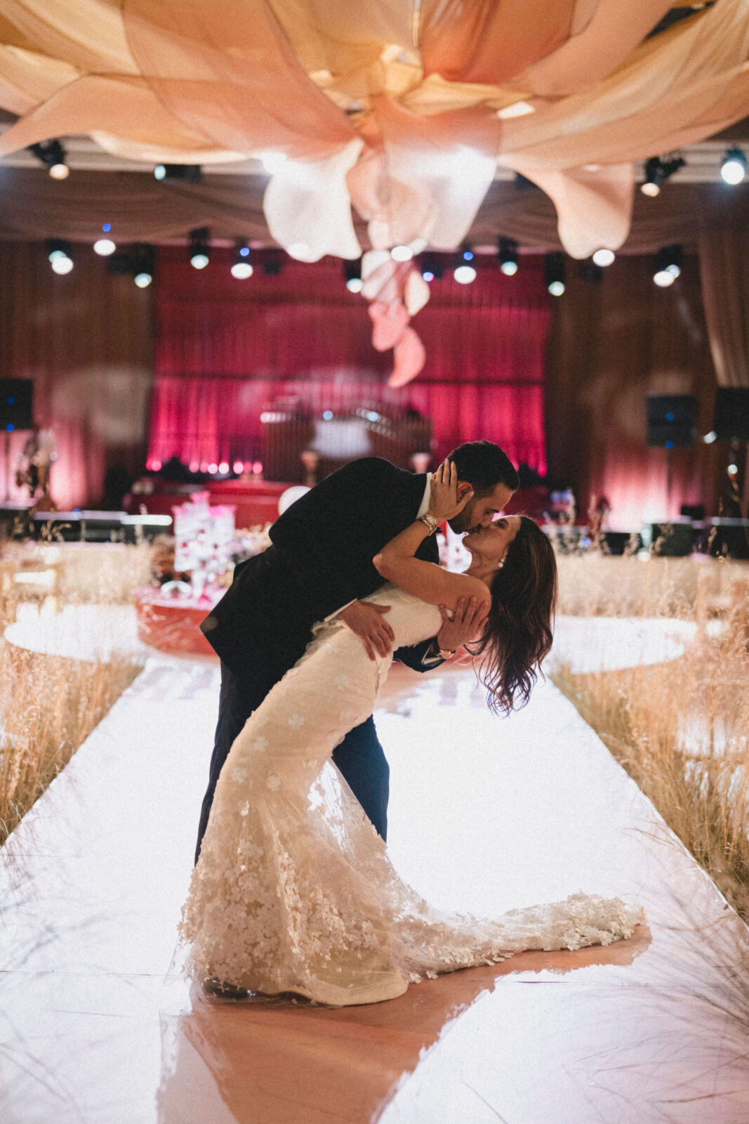 bride and groom kissing at the wedding