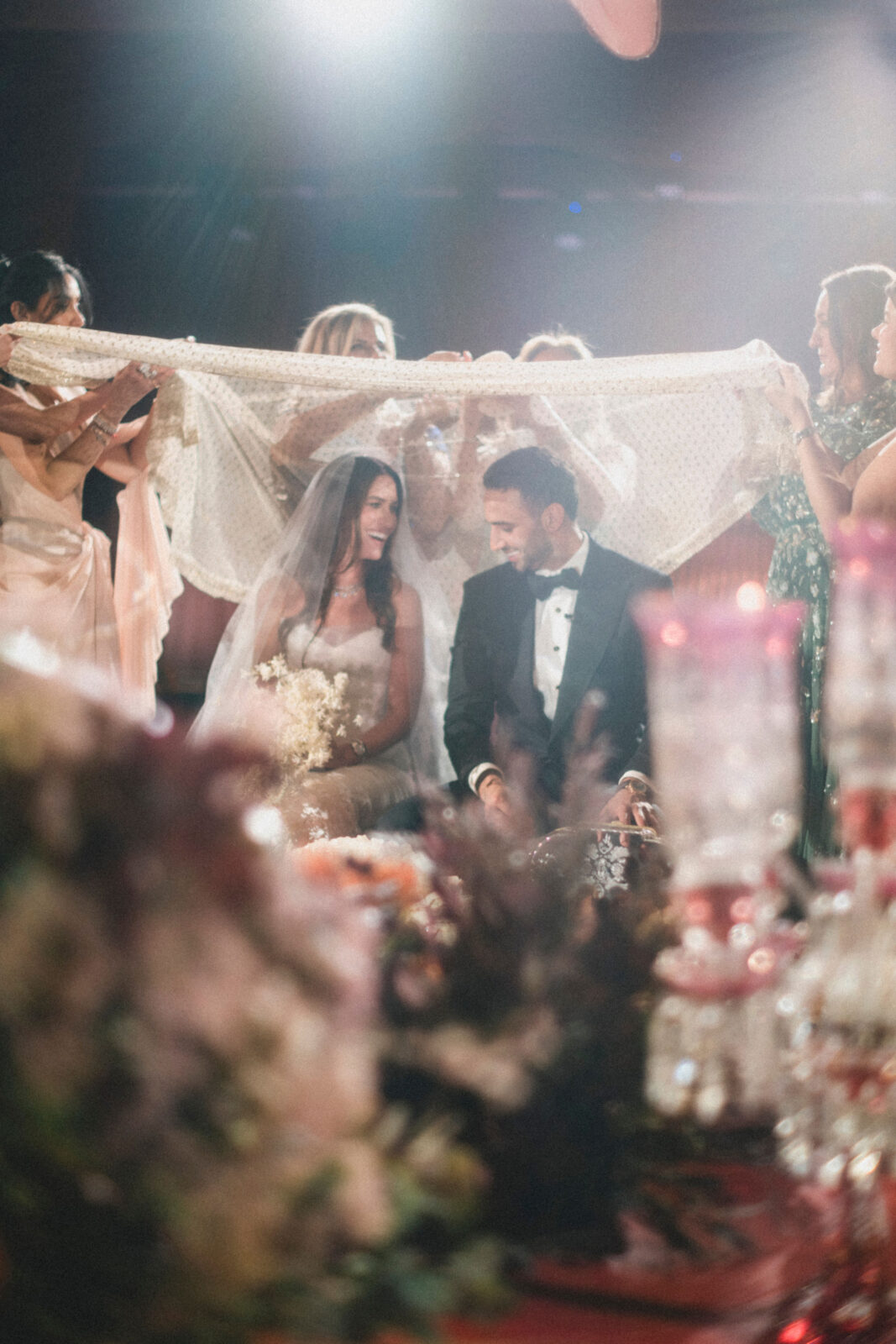 bride and groom with veil