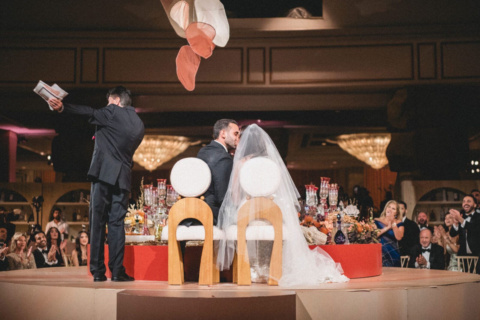 couple kissing in front of visitors