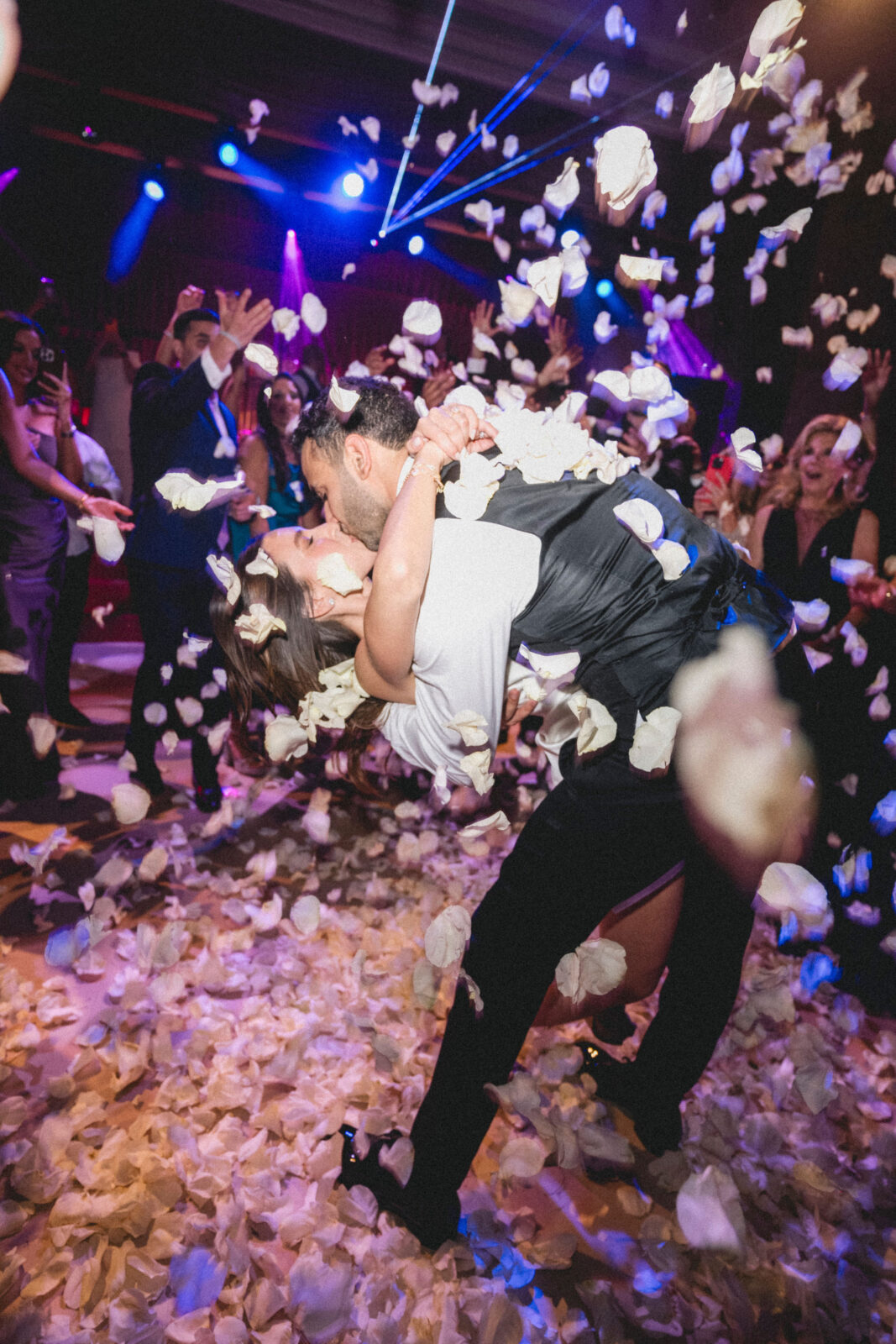 bride and groom kissing on the dance floor