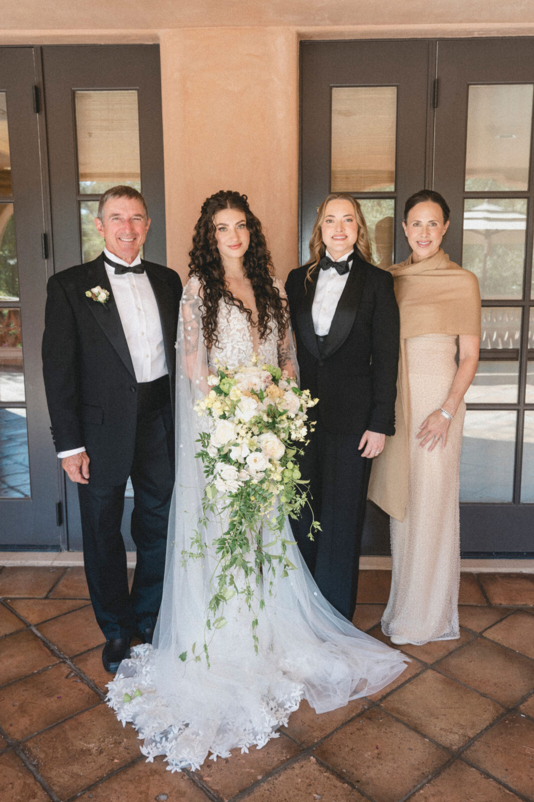 bride and groom with their parents