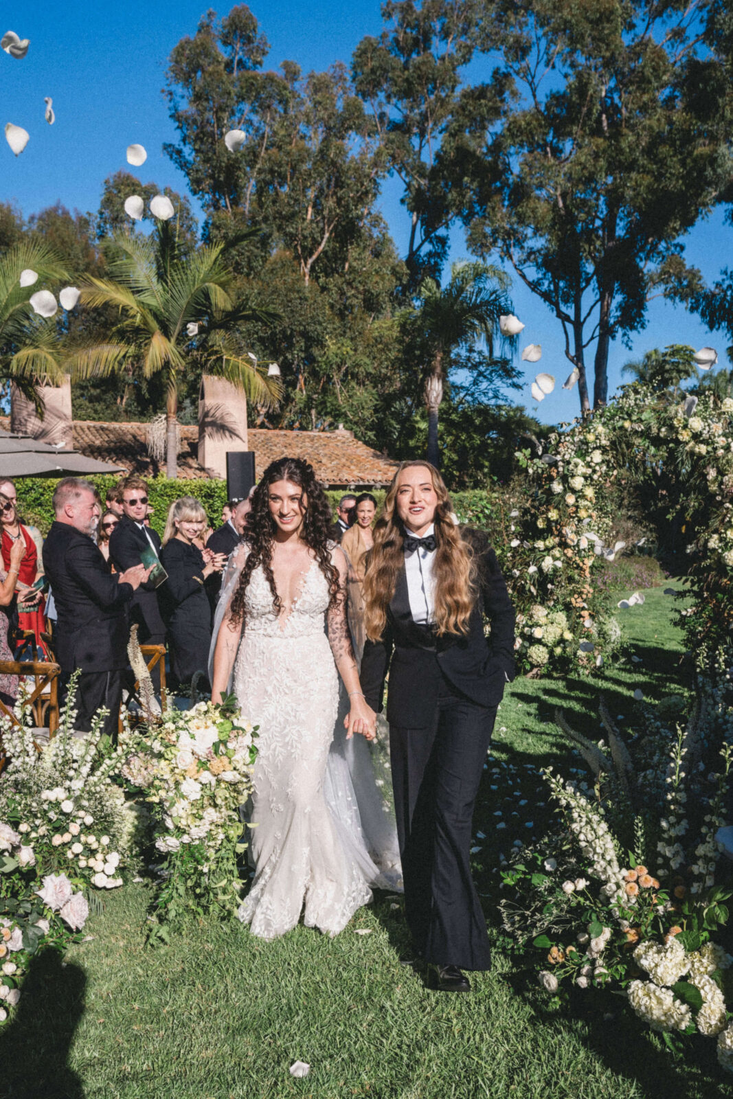 bride and groom walking in the aisle