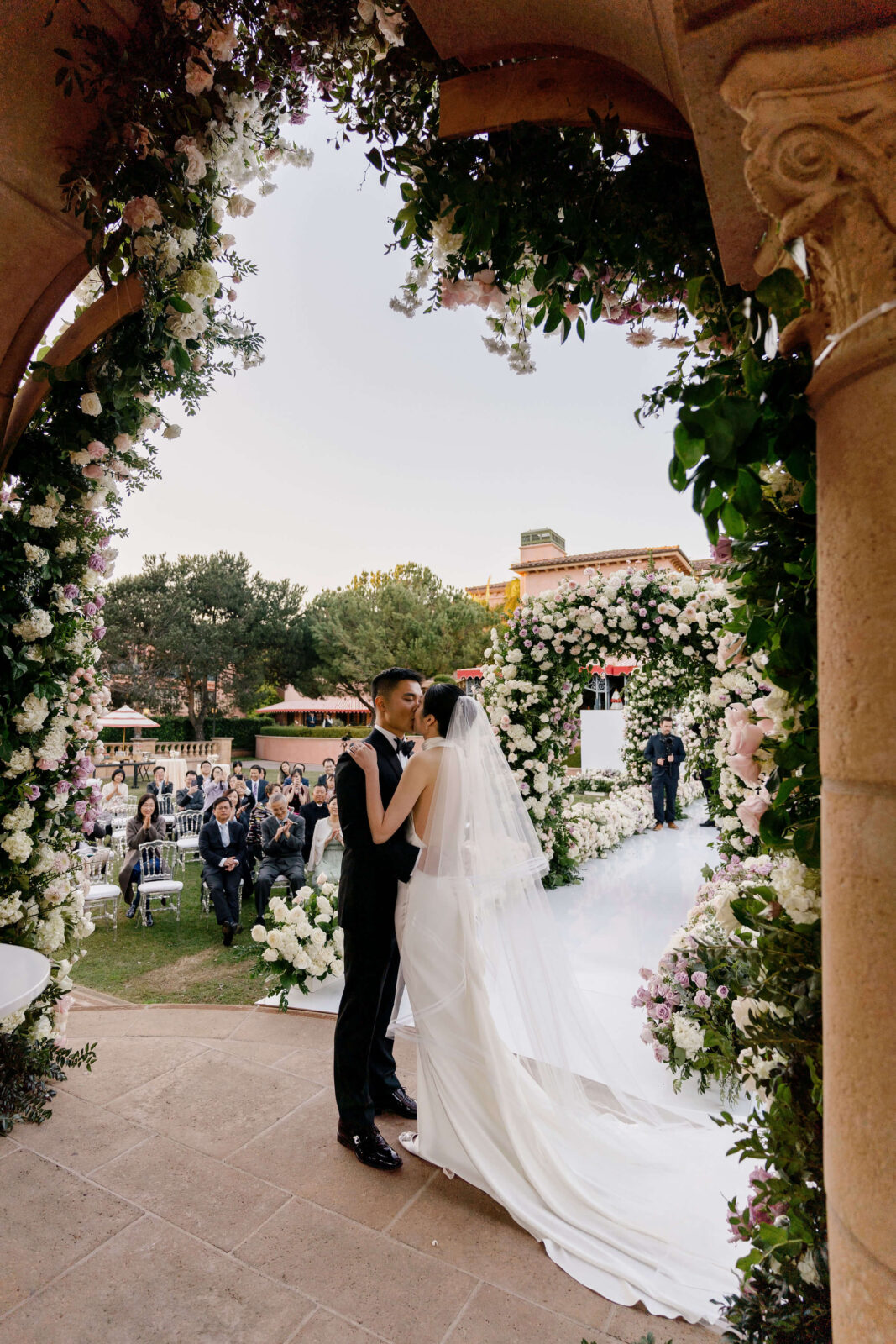 bride and groom kissing after vows