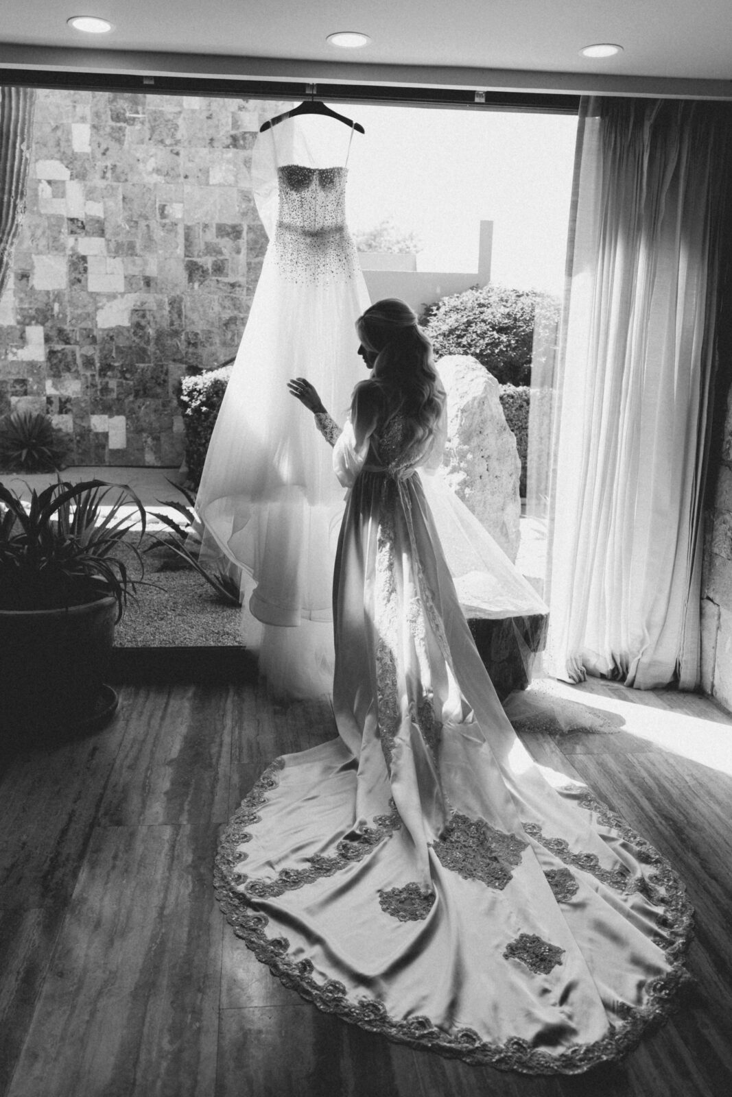 black and white photo of bride and wedding gown