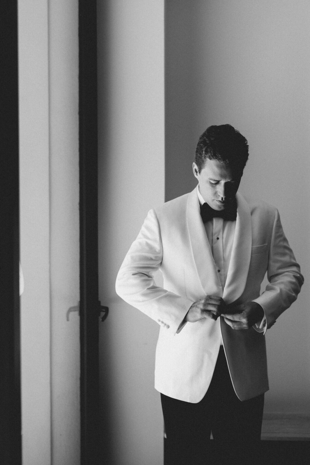 groom setting his suit