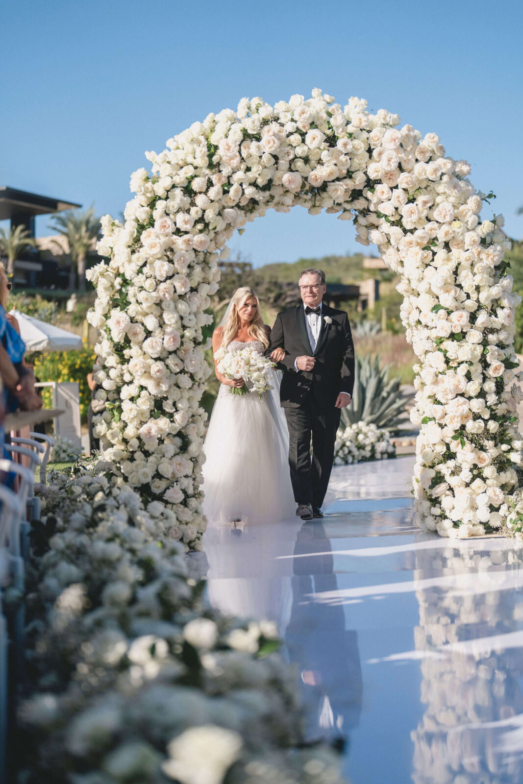 bride and her father walking down the aisle