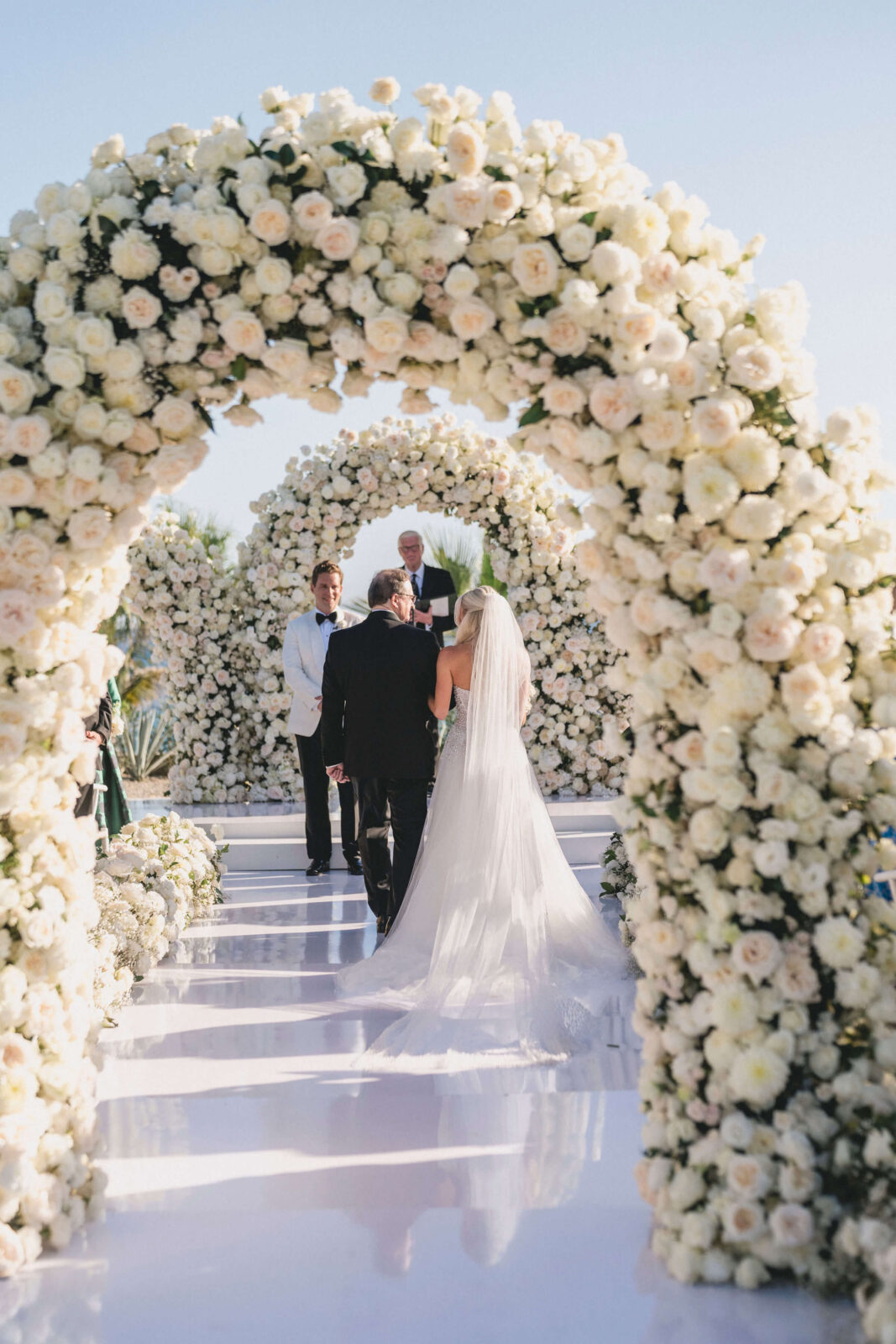 bride and her father walking down the aisle