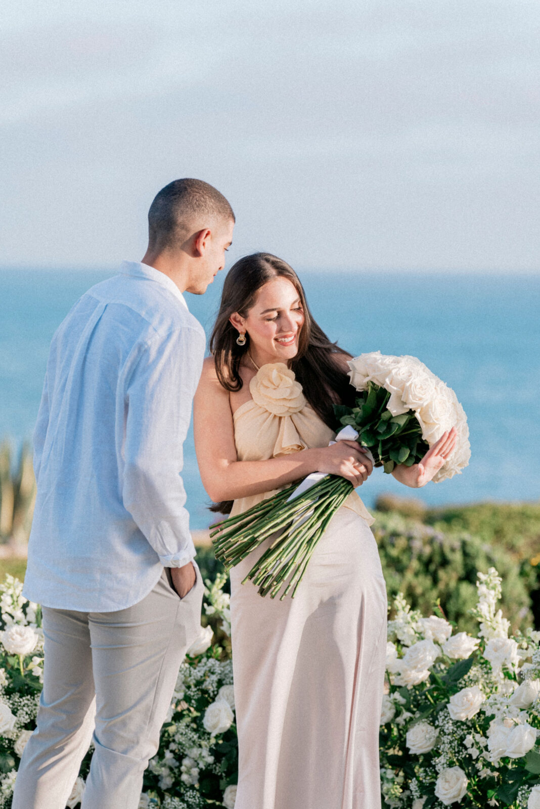 woman accepting flower from man