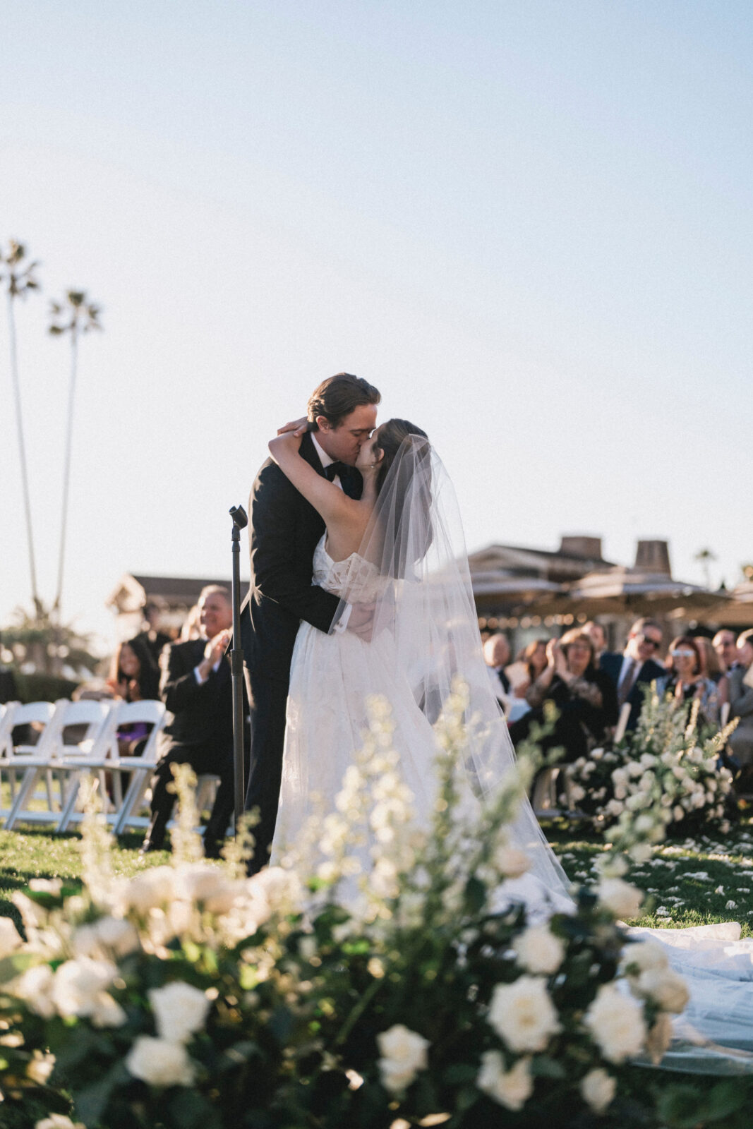 bride and groom kissing during ceremony