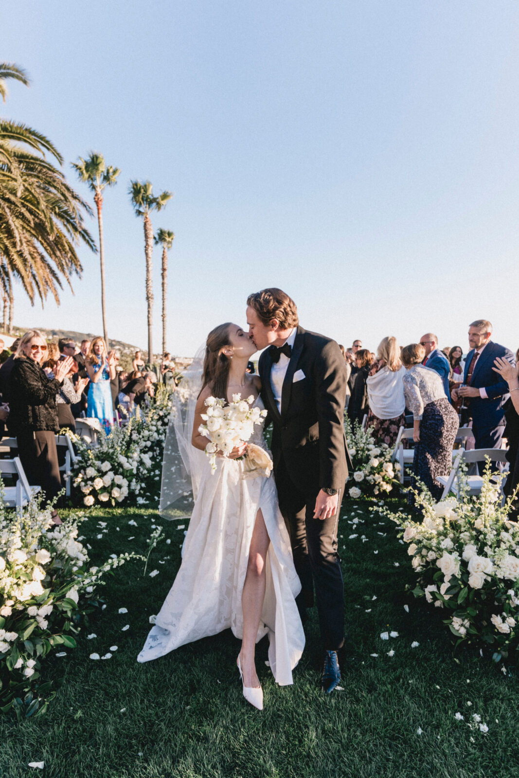 bride and groom kissing after ceremony