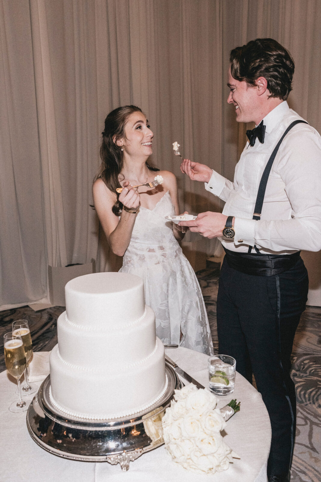 bride and groom sharing cake