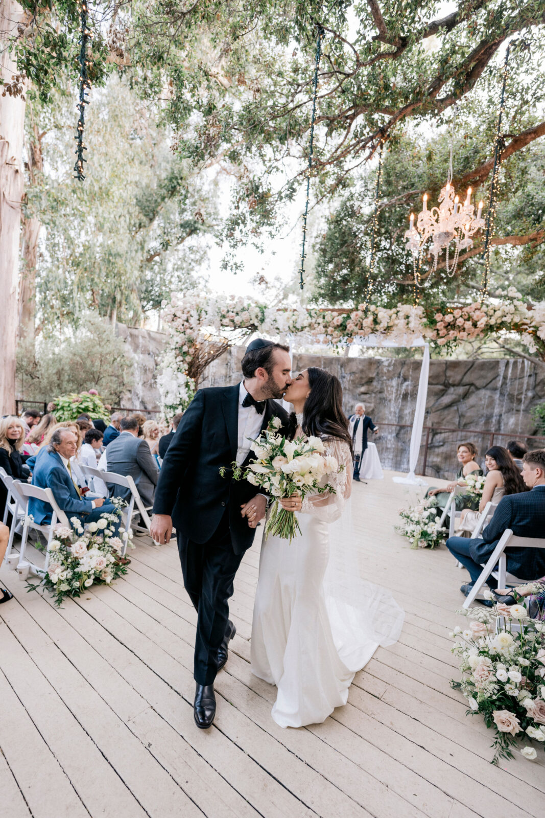 bride and groom kissing after ceremony