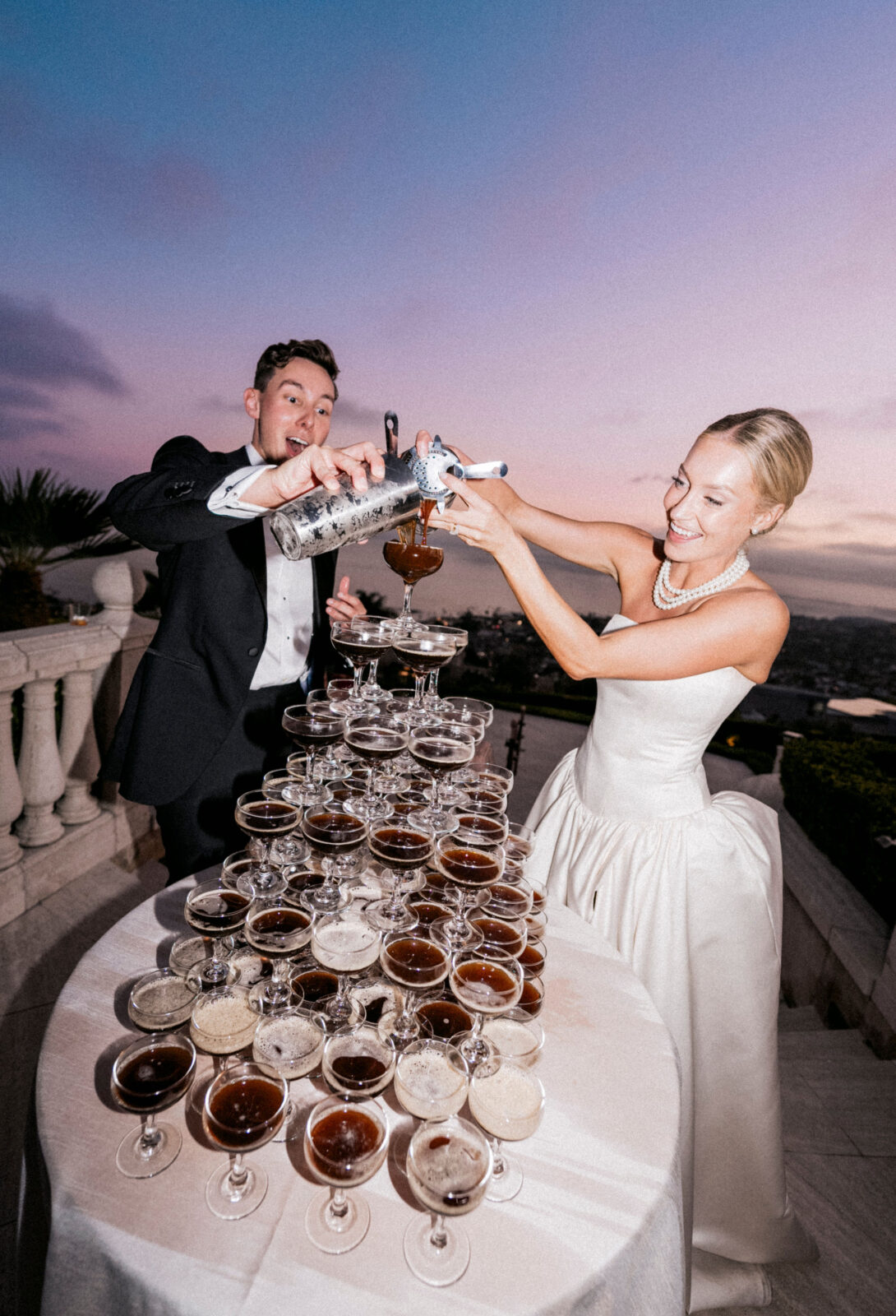 bride and groom pouring wine 