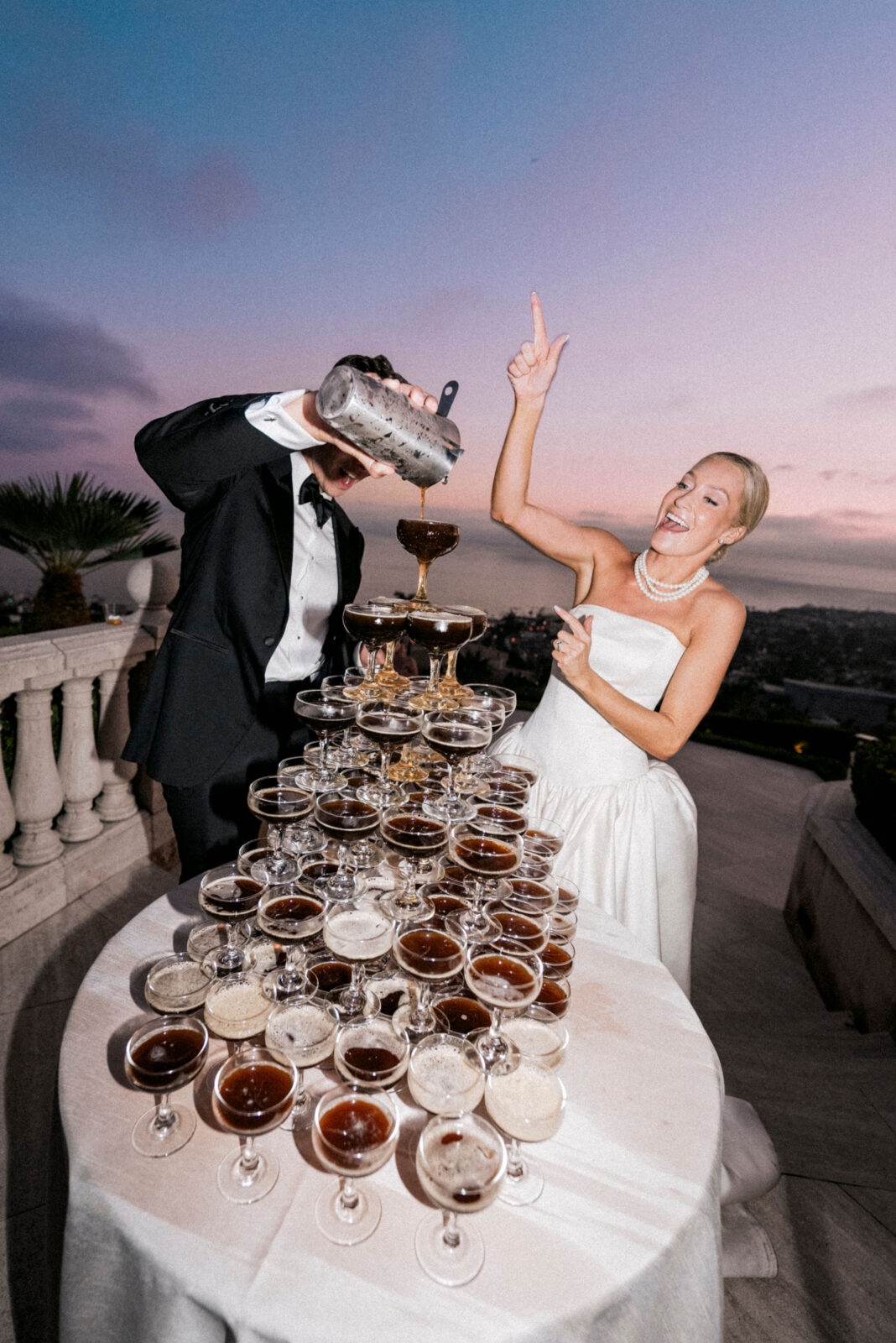 bride and groom pouring wine 