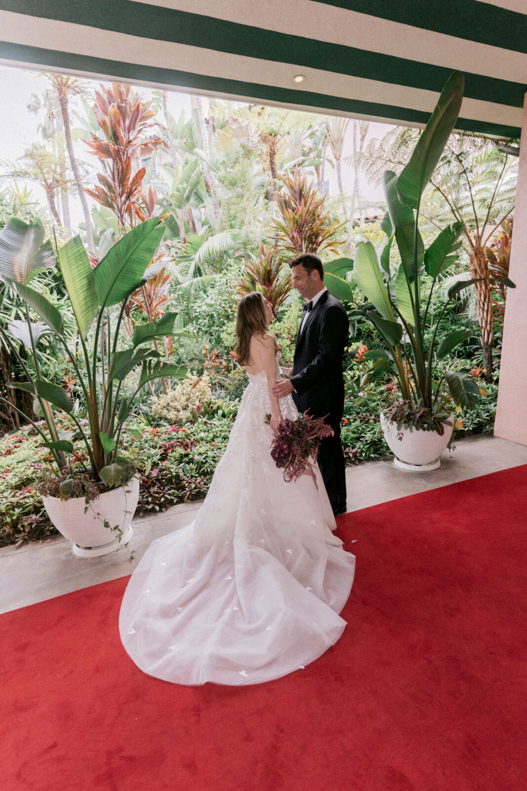 bride and groom looking at each other 