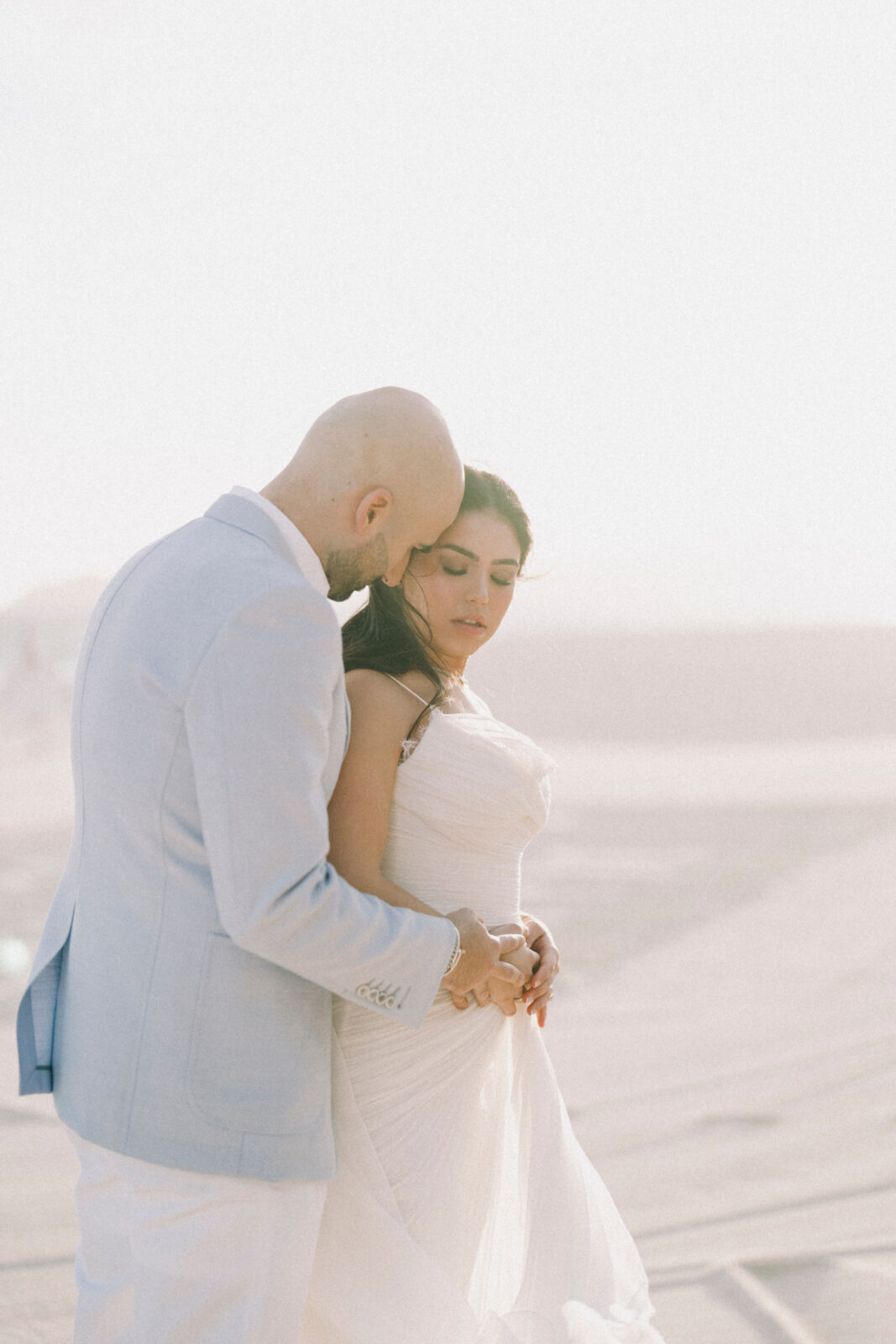 bride and groom hugging each other