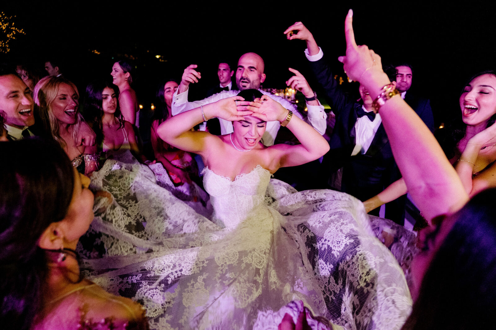 bride and groom dancing with friends