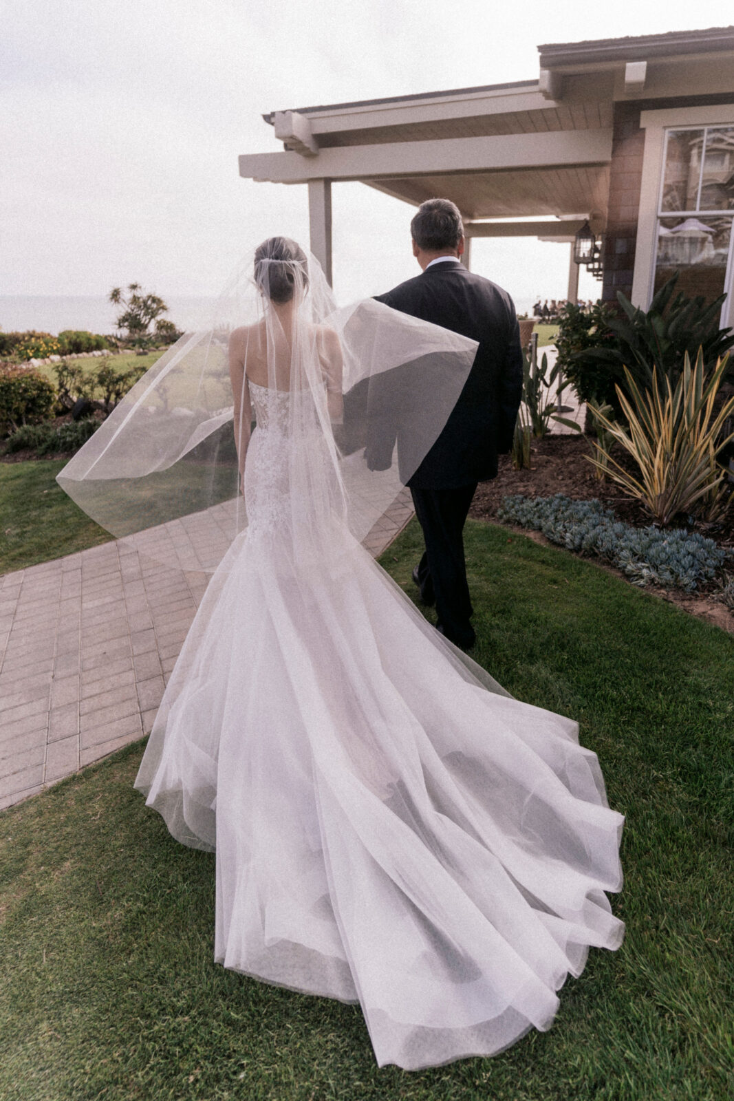 bride with her father walking down the aisle