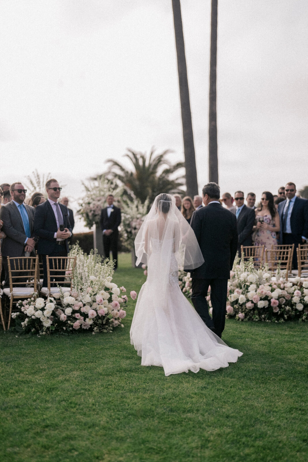 bride with her father walking down the aisle