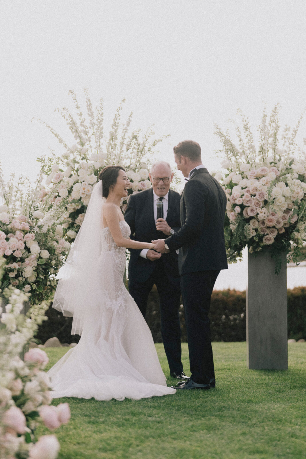 bride and groom happily exchanging vows