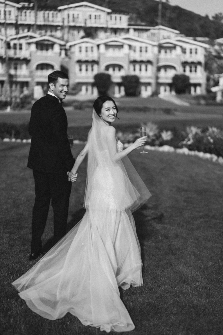 bride and groom looking back and smiling