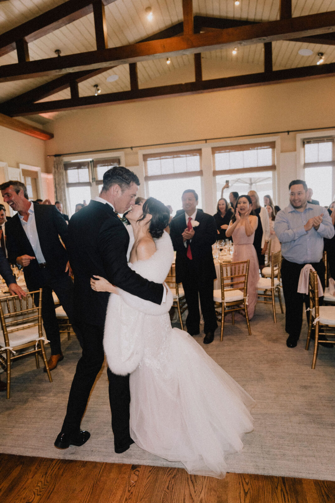 bride and groom hugging 