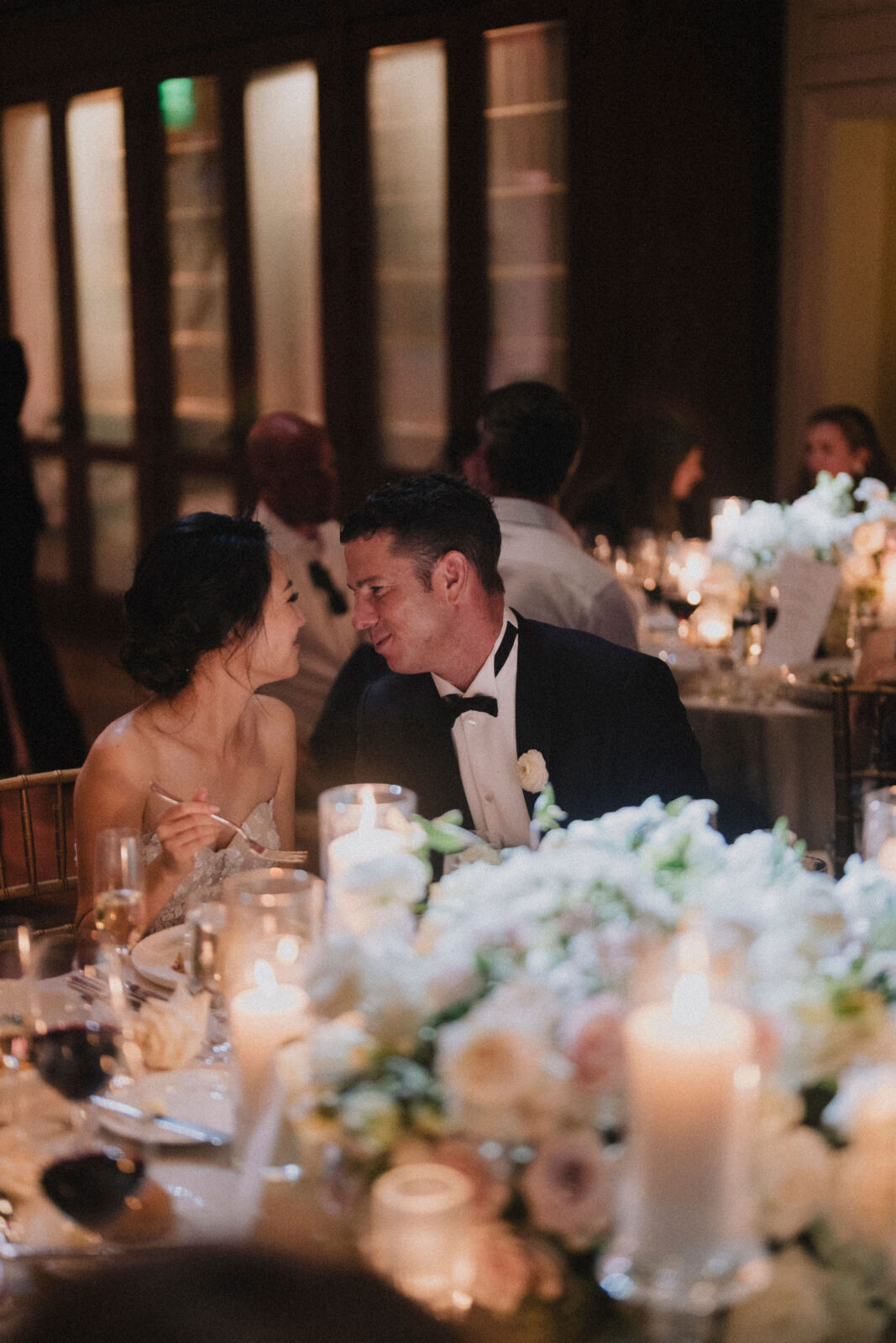 bride and groom staring at each other