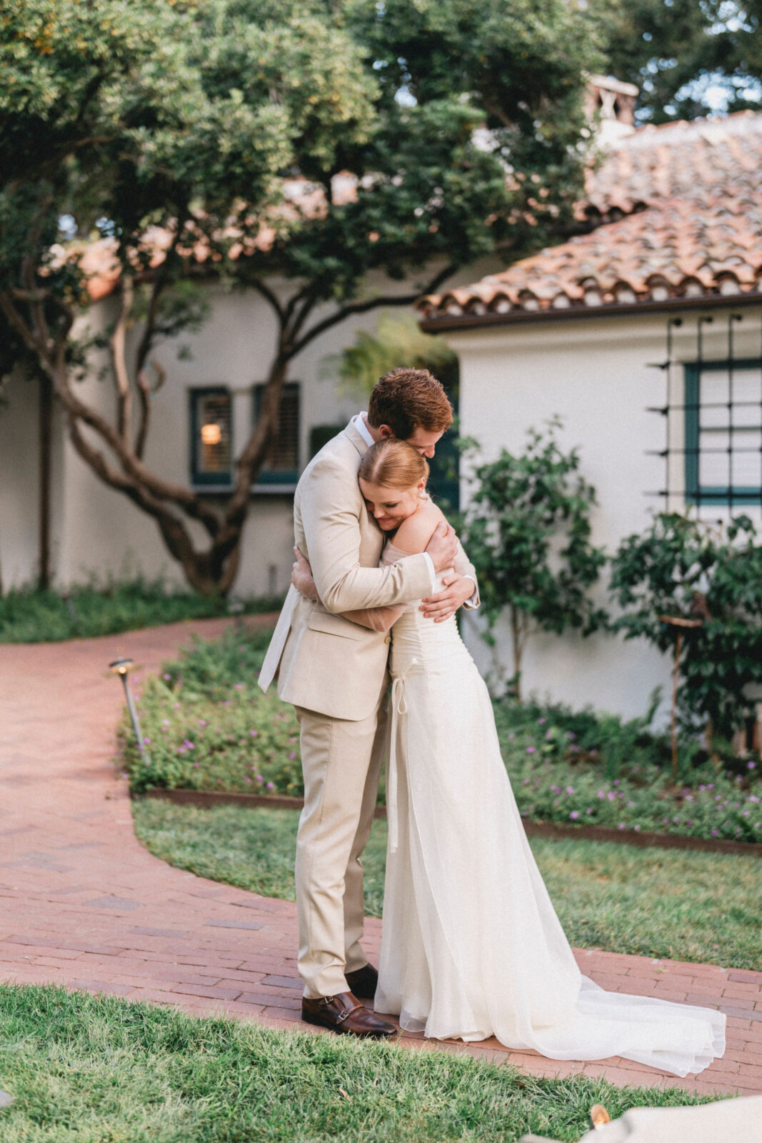 bride and groom hugging