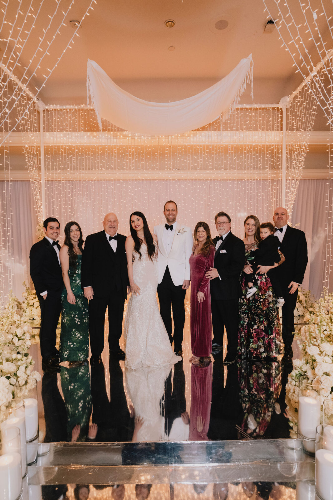 bride and groom with their respective families