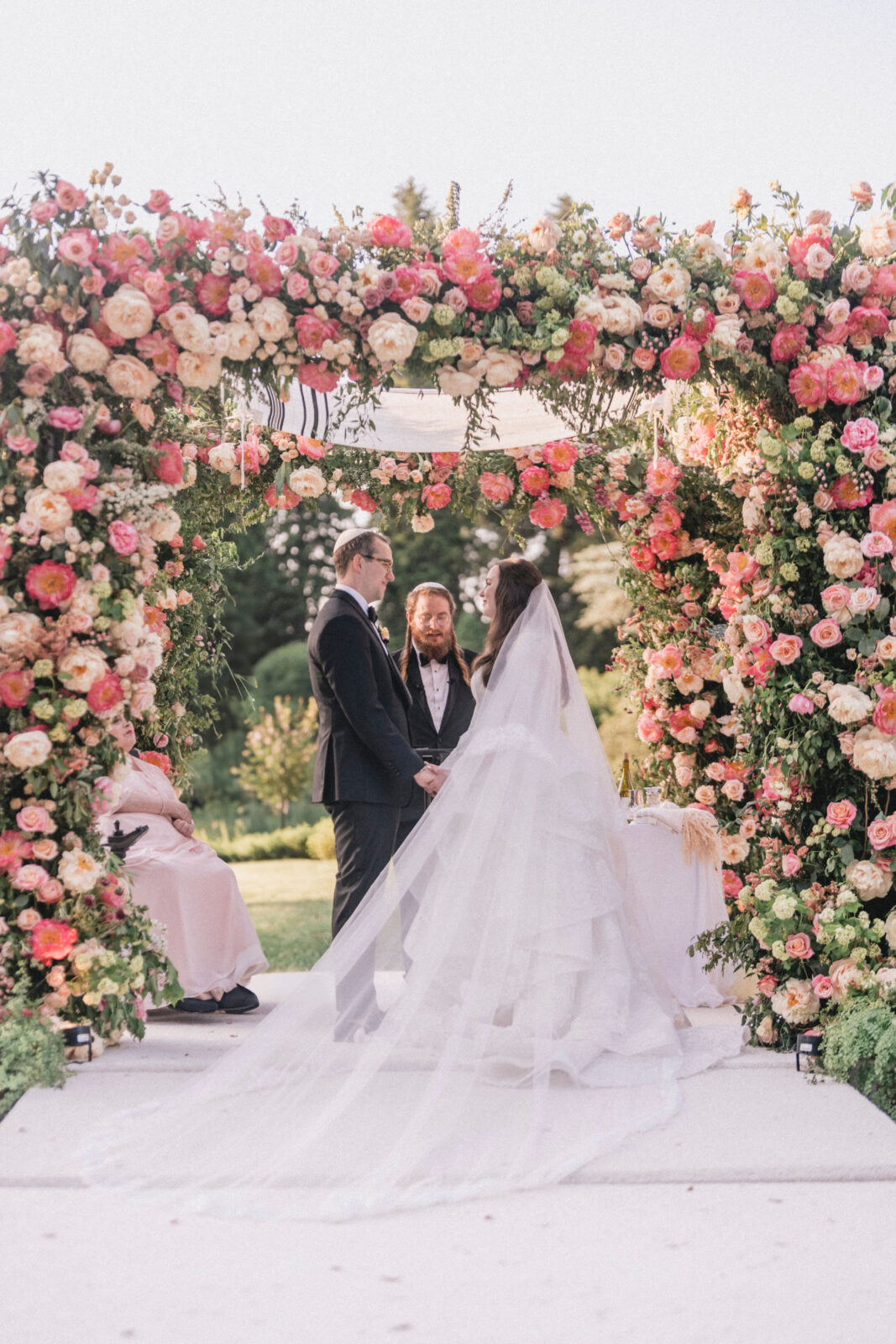 Bride and Groom taking vows at the altar in Winterthur Garden