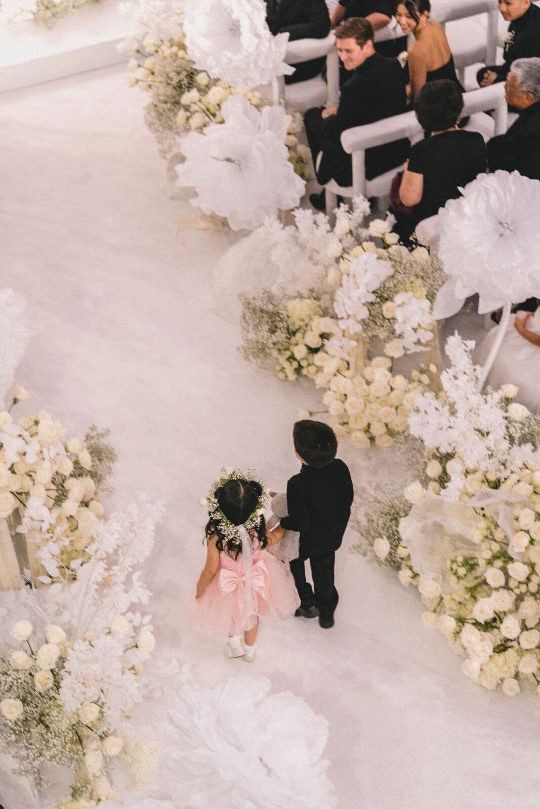 flower girl and ring bearer walking the aisle