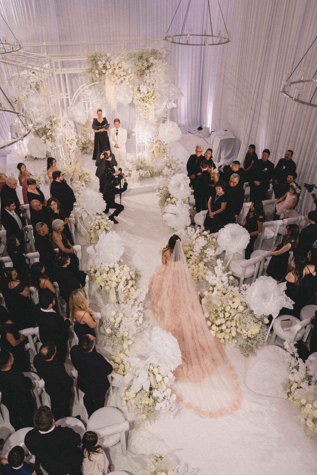 bride walking on the aisle towards the groom