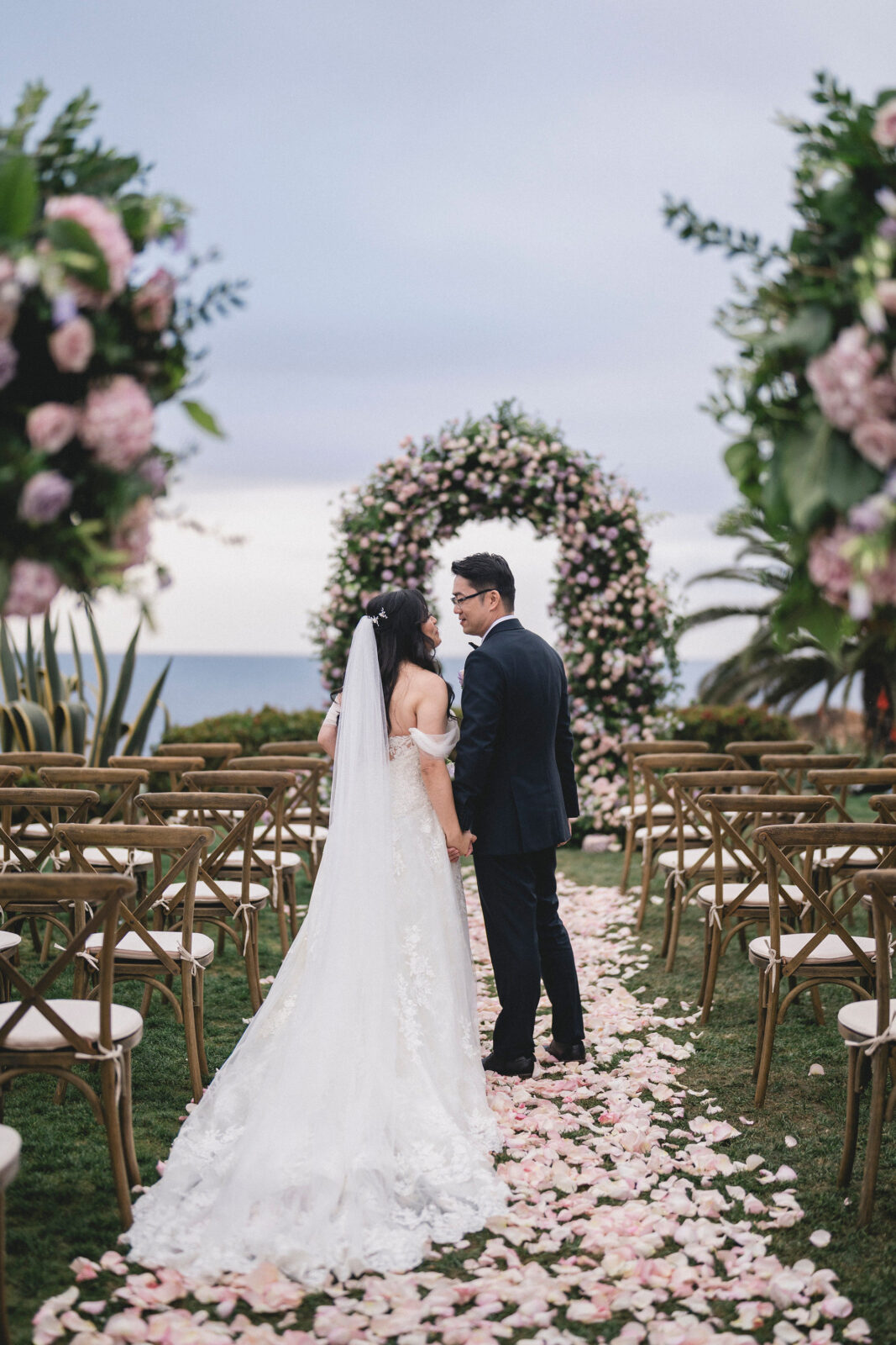 bride and groom staring at each other 