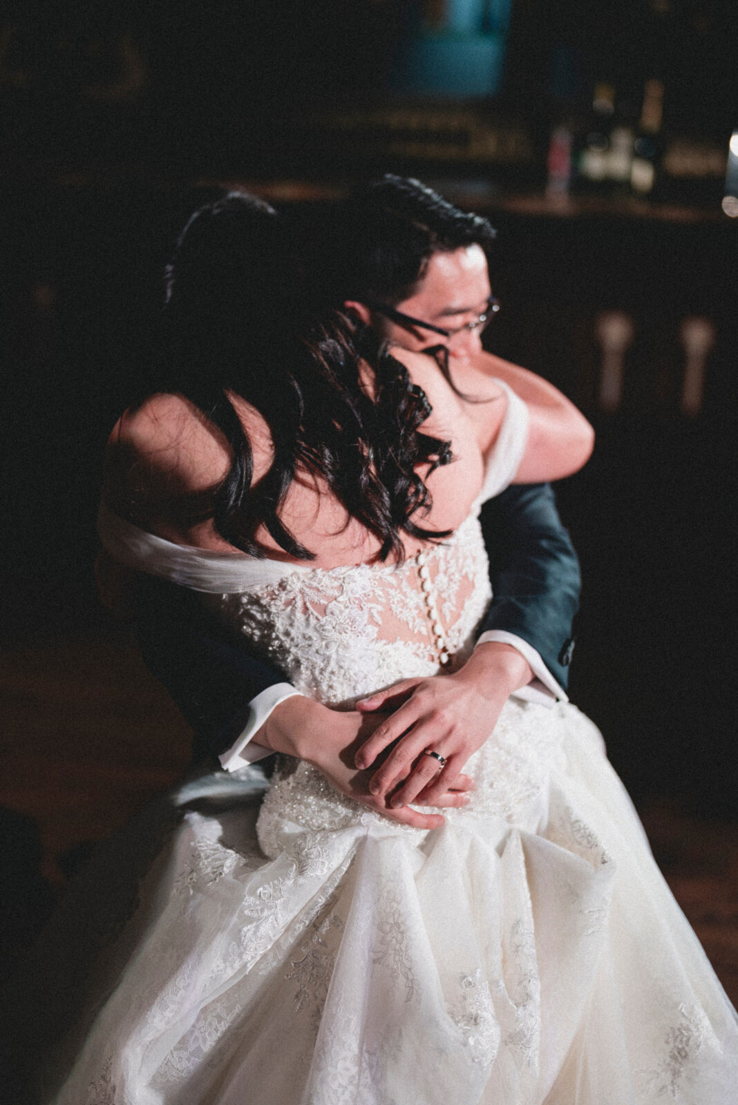 bride and groom hugging