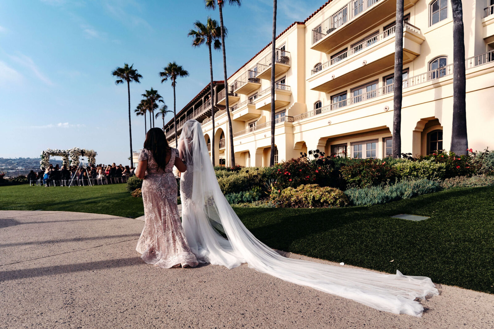 bride and sister walking down the aisle