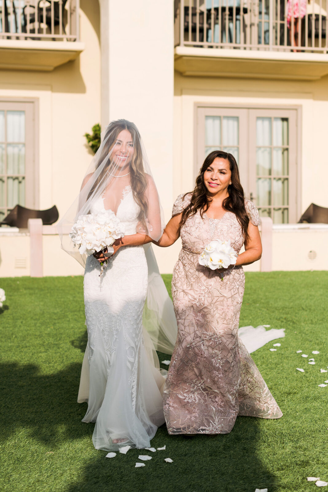 bride and sister walking down the aisle