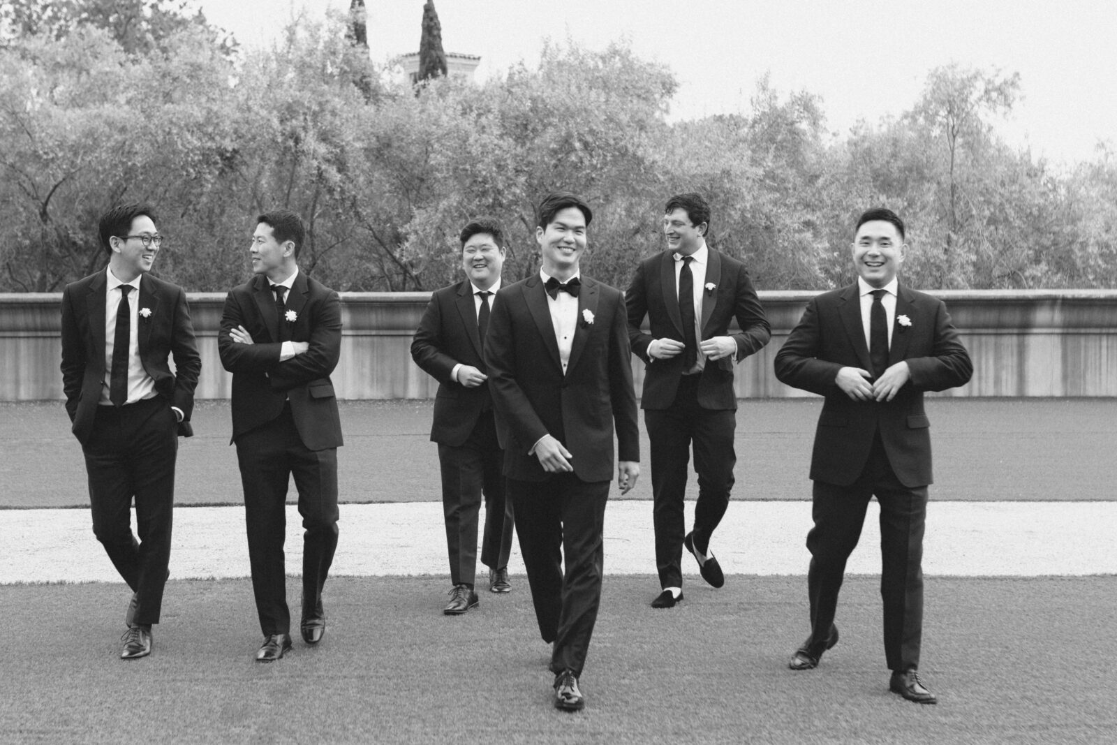 groom and his groomsmen black and white photo