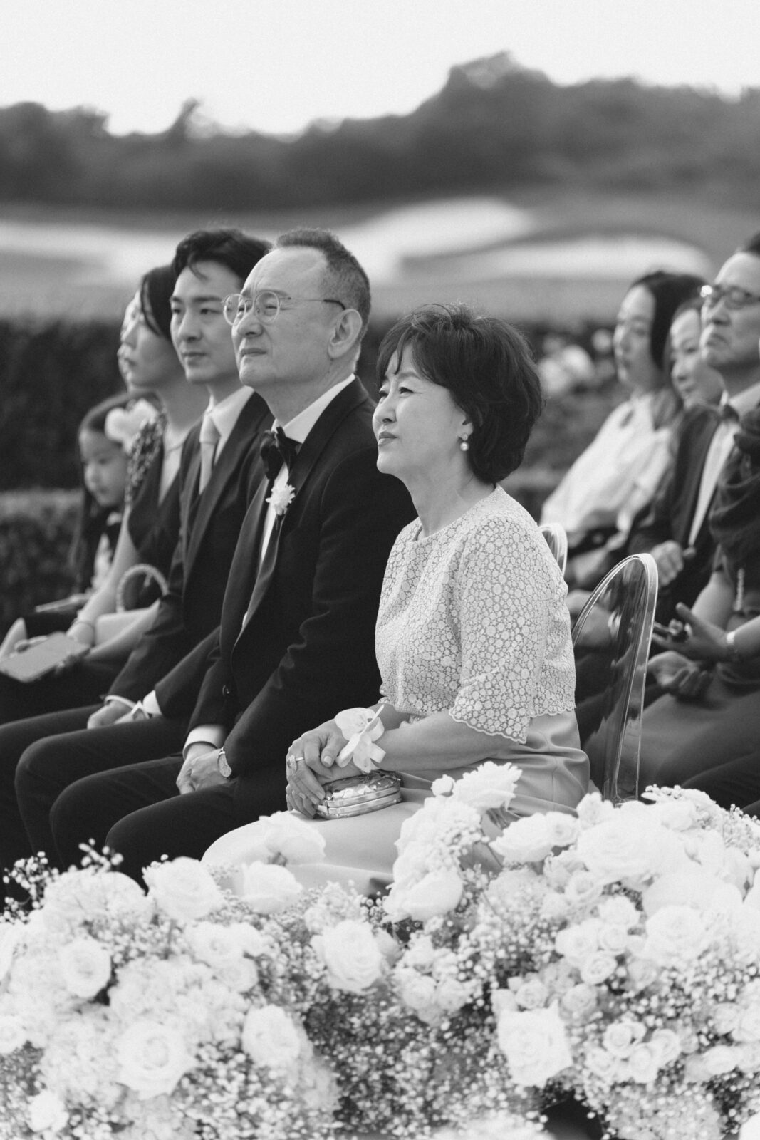 bride and groom's parents in black and white