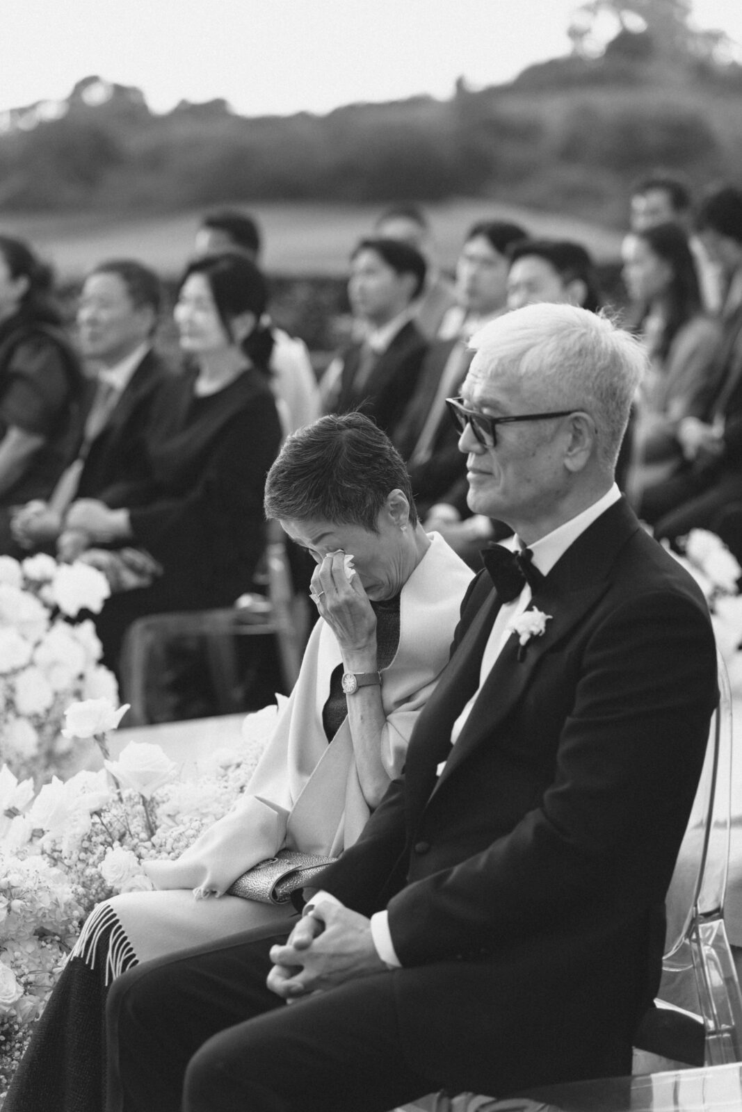 bride and groom's parents in black and white