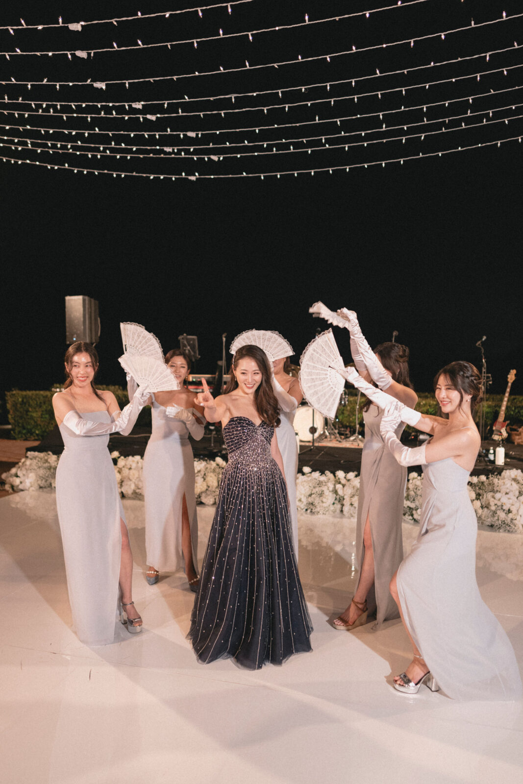 bride dancing with the bridesmaids