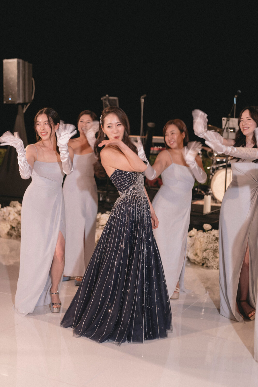 bride dancing with the bridesmaids