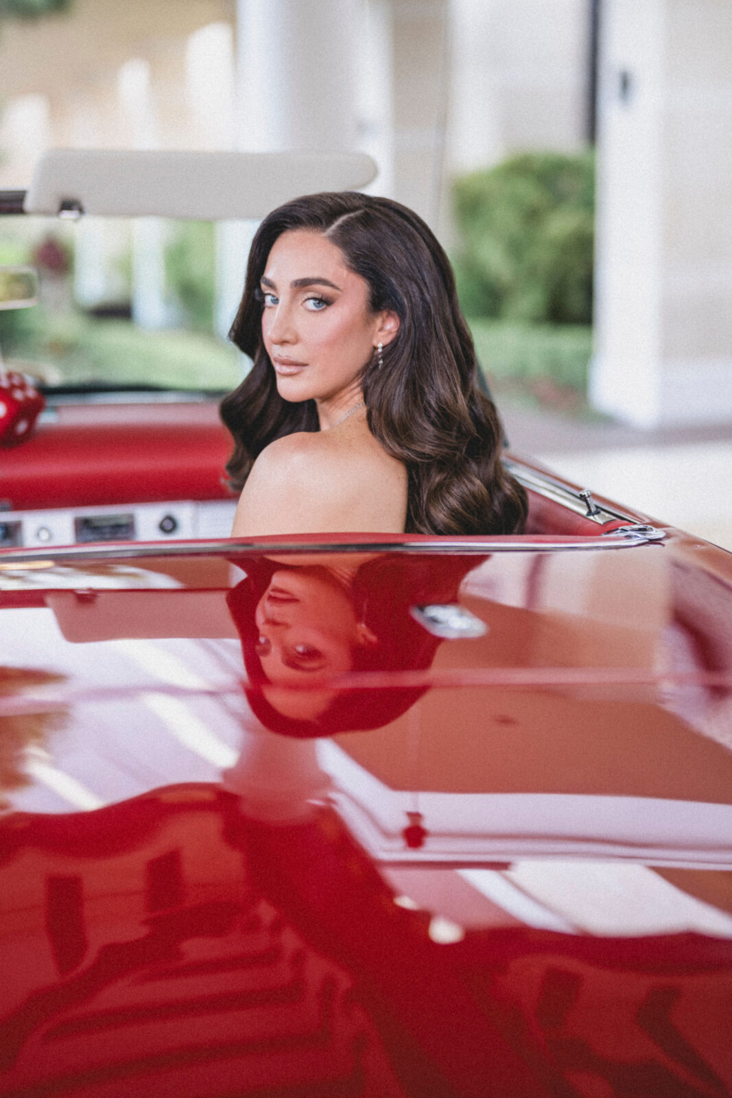 bride riding a sportscar