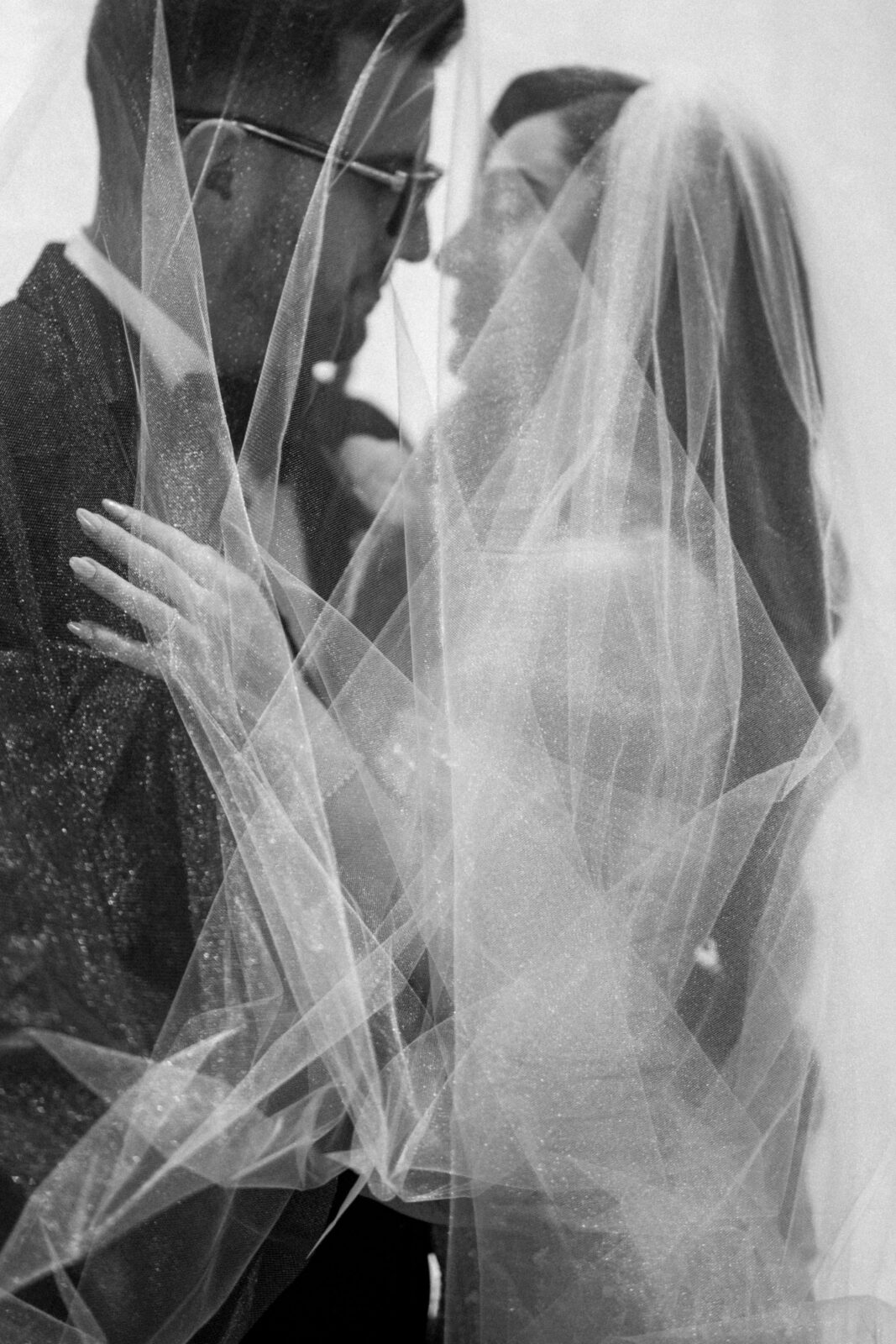 black and white photo of groom and bride 