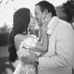 bride holding groom's face