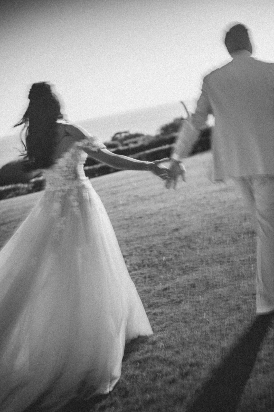 bride and groom holding hands