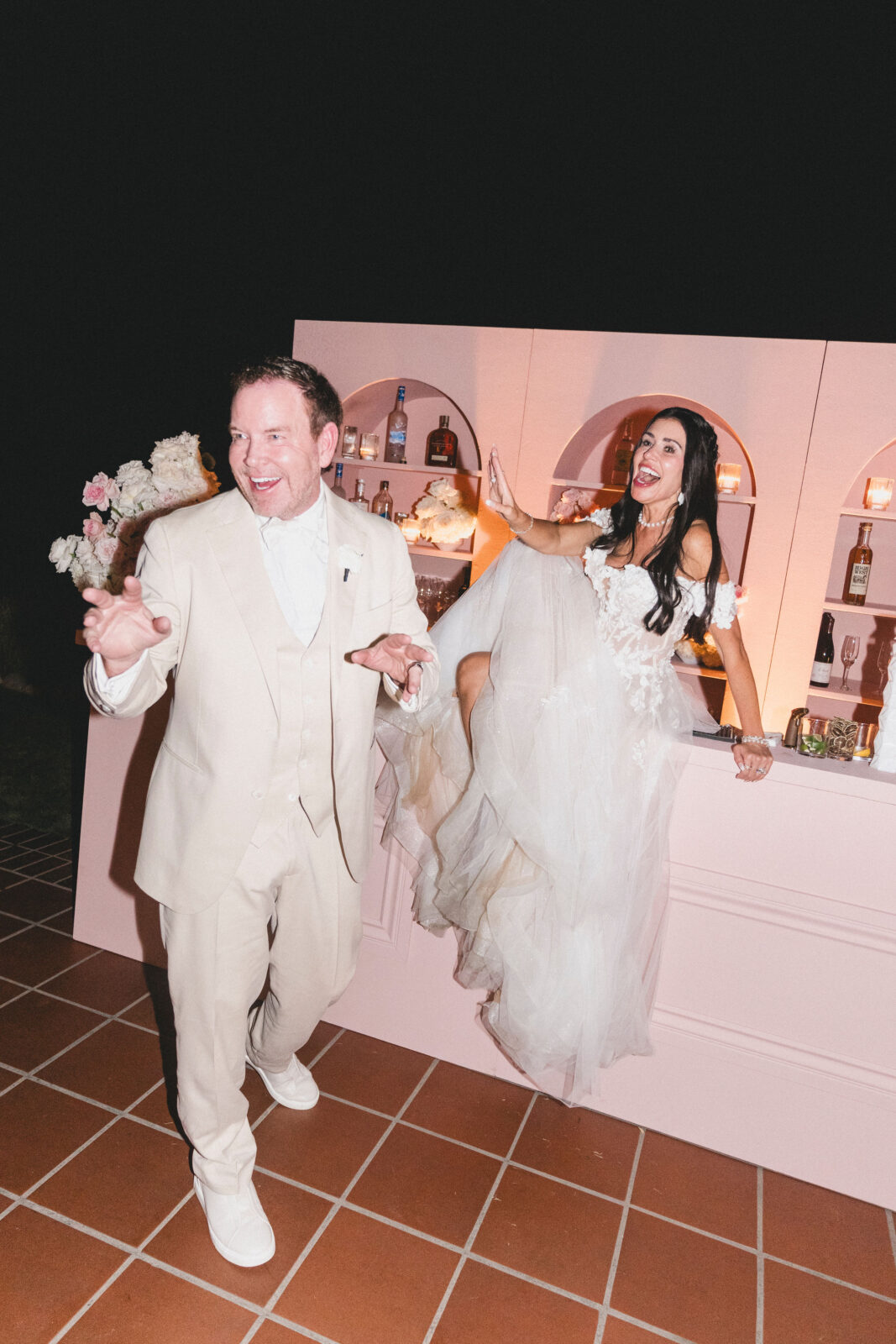 bride and groom laughing