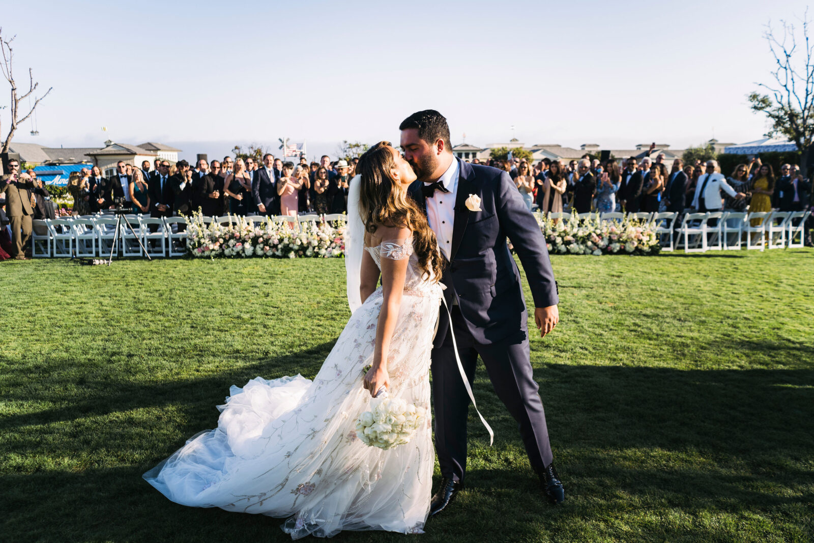 bride and groom kissing after their exchanged vows